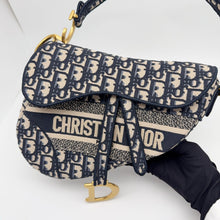 Load image into Gallery viewer, Dior blue oblique monogram jacquard medium saddle bag, with gold hardware and guitar strap