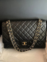 Load image into Gallery viewer, Chanel black caviar Maxi single flap, gold hdw.