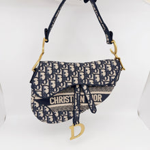 Load image into Gallery viewer, Dior blue oblique monogram jacquard medium saddle bag, with gold hardware and guitar strap