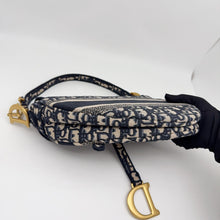 Load image into Gallery viewer, Dior blue oblique monogram jacquard medium saddle bag, with gold hardware and guitar strap