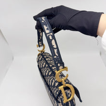 Load image into Gallery viewer, Dior blue oblique monogram jacquard medium saddle bag, with gold hardware and guitar strap