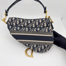 Load image into Gallery viewer, Dior blue oblique monogram jacquard medium saddle bag, with gold hardware and guitar strap