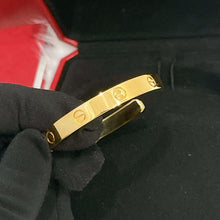 Load image into Gallery viewer, Cartier bangle open style, 18k yellow gold, size 19
