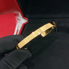 Load image into Gallery viewer, Cartier bangle open style, 18k yellow gold, size 19
