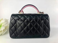 Load image into Gallery viewer, Chanel 2023 black / pink mini top handle lambksin, with light gold hardware
