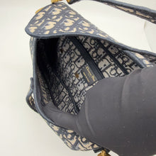 Load image into Gallery viewer, Dior blue oblique monogram jacquard medium saddle bag, with gold hardware and guitar strap
