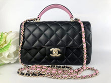 Load image into Gallery viewer, Chanel 2023 black / pink mini top handle lambksin, with light gold hardware
