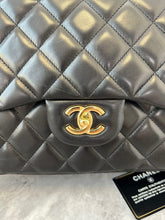 Load image into Gallery viewer, Chanel black lambskin jumbo classic flap with gold hardware
