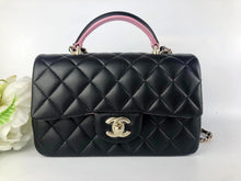Load image into Gallery viewer, Chanel 2023 black / pink mini top handle lambksin, with light gold hardware
