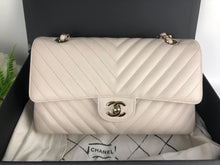 Load image into Gallery viewer, Chanel ivory caviar chevron medium, gold champagne hardware
