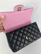 Load image into Gallery viewer, Chanel 2023 black / pink mini top handle lambksin, with light gold hardware

