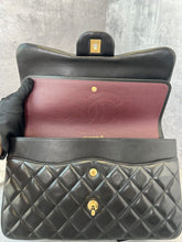 Load image into Gallery viewer, Chanel black lambskin jumbo classic flap with gold hardware
