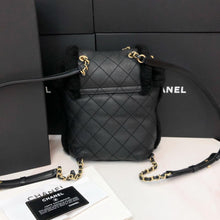 Load image into Gallery viewer, Chanel shearling and lambskin  backpack black, gold hdw
