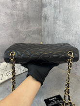 Load image into Gallery viewer, Chanel black lambskin jumbo classic flap with gold hardware
