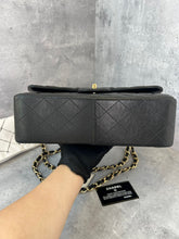 Load image into Gallery viewer, Chanel black lambskin jumbo classic flap with gold hardware
