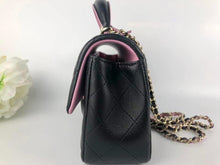 Load image into Gallery viewer, Chanel 2023 black / pink mini top handle lambksin, with light gold hardware
