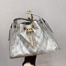 Load image into Gallery viewer, Chanel 25 small in silver caviar, aged gold hdw
