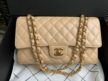 Load image into Gallery viewer, Chanel medium beige caviar classic flap with gold hdw
