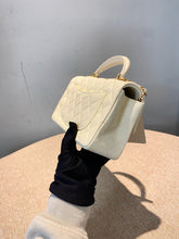 Load image into Gallery viewer, Chanel white caviar mini top handle with aged gold hdw
