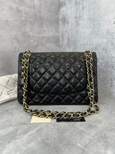 Load image into Gallery viewer, Chanel black lambskin jumbo classic flap with gold hardware
