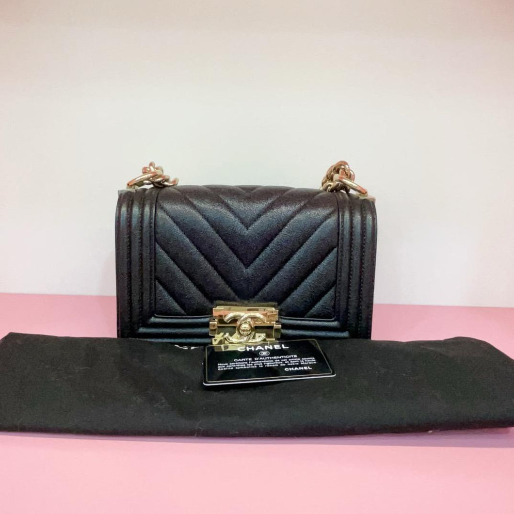 Chanel small black boy bag, caviar chevron, with gold hdw