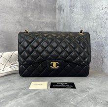 Load image into Gallery viewer, Chanel black lambskin jumbo classic flap with gold hardware
