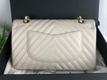 Load image into Gallery viewer, Chanel ivory caviar chevron medium, gold champagne hardware
