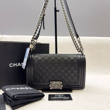 Load image into Gallery viewer, Chanel old medium boy black caviar with ruthenium hardware
