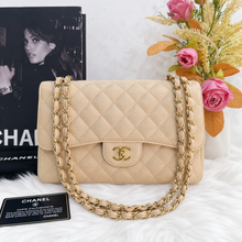 Load image into Gallery viewer, Chanel double flap jumbo beige caviar with gold hardware.
