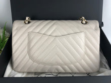 Load image into Gallery viewer, Chanel 18b ivory chevron caviar medium classic with light gold hdw
