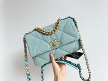 Load image into Gallery viewer, Chanel 19 small light blue denim, mixed gold hdw
