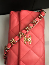 Load image into Gallery viewer, Chanel lambskin woven logo flap from 2021 cruise collection.
