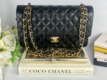 Load image into Gallery viewer, Chanel black medium lambskin classic, with gold hdw
