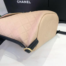 Load image into Gallery viewer, Chanel beige black filigree backpack
