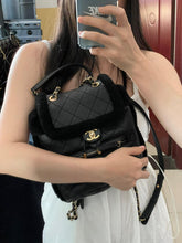 Load image into Gallery viewer, Chanel shearling and lambskin  backpack black, gold hdw
