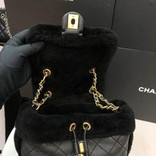 Load image into Gallery viewer, Chanel shearling and lambskin  backpack black, gold hdw
