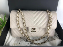 Load image into Gallery viewer, Chanel ivory caviar chevron medium, gold champagne hardware
