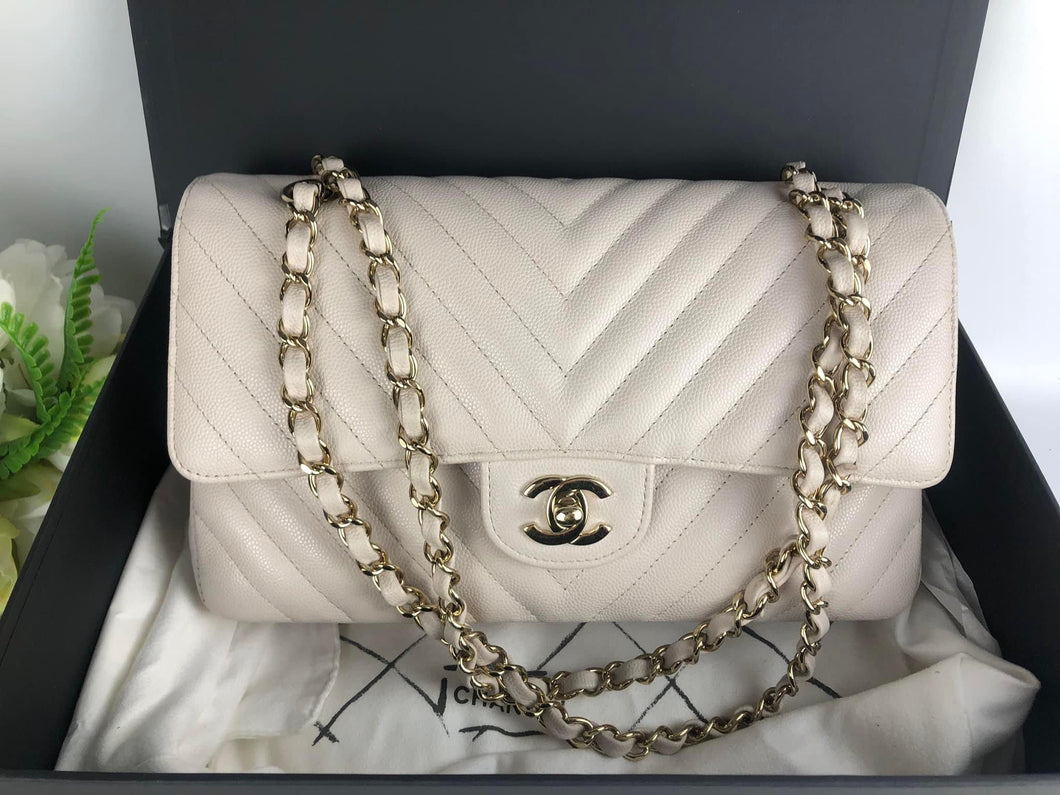 Chanel ivory caviar chevron medium, gold champagne hardware