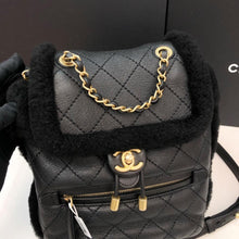 Load image into Gallery viewer, Chanel shearling and lambskin  backpack black, gold hdw
