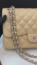 Load and play video in Gallery viewer, Chanel 19 series beige caviar jumbo, silver hdw
